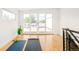 Bright upper bonus room with workout space, a large sliding glass door and access to a rooftop deck at 3957 Utica St, Denver, CO 80212