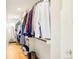 Spacious walk-in closet with custom shelving and ample storage for clothes, shoes and accessories at 3957 Utica St, Denver, CO 80212