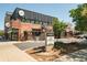 Commercial real estate building featuring brick and black metal siding with outdoor patio at 3957 Utica St, Denver, CO 80212