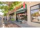Charming commercial building with a vintage sign, bright green accents, and large windows at 3957 Utica St, Denver, CO 80212