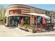 Modern brick commercial building with patio, large windows, and outdoor seating area at 3957 Utica St, Denver, CO 80212