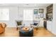 Cozy living room with curated decor, beverage center and plenty of natural light at 3957 Utica St, Denver, CO 80212