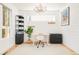 Bright home office with modern desk, ample storage, and elegant chandelier at 3957 Utica St, Denver, CO 80212