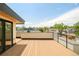 Rooftop deck with glass door leading to the interior and views of trees and other homes at 3957 Utica St, Denver, CO 80212