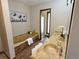 A primary bathroom features a soaking tub, stone countertops, and dual sinks at 53 Douglas S Dr, Broomfield, CO 80020