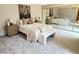 Serene bedroom with a queen bed, mirrored closet doors, and ample natural light at 53 Douglas S Dr, Broomfield, CO 80020