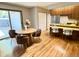 Bright dining area with a wooden table, chairs, and sliding glass doors to the outside at 53 Douglas S Dr, Broomfield, CO 80020
