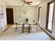 Bright dining room with a glass table, modern chairs, and a large window at 53 Douglas S Dr, Broomfield, CO 80020