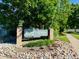 Neighborhood sign 'Gate N Green' with colorful flowers at 53 Douglas S Dr, Broomfield, CO 80020