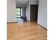 Inviting entryway with hardwood floors and tile flooring, leading to an open living space at 53 Douglas S Dr, Broomfield, CO 80020