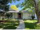 Charming single-story home with a walkway, trees and a well-maintained lawn at 53 Douglas S Dr, Broomfield, CO 80020