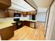 Kitchen features wooden cabinets, black appliances and light countertops at 53 Douglas S Dr, Broomfield, CO 80020