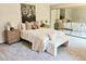 A cozy main bedroom with plush carpet, soft bedding, and a large mirrored closet at 53 Douglas S Dr, Broomfield, CO 80020