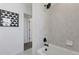 Bright bathroom showcasing modern black shower fixtures and gray ceramic tile at 13326 Blue Amber Ct, Parker, CO 80134