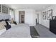 Comfortable bedroom with neutral color scheme, stylish furnishings, and a view of the ensuite at 13326 Blue Amber Ct, Parker, CO 80134