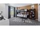 A bedroom features a bunk bed, large window, and gray carpet at 13326 Blue Amber Ct, Parker, CO 80134