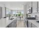 Kitchen with stainless steel appliances, a large island, and a view into the dining area at 13326 Blue Amber Ct, Parker, CO 80134