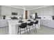 Kitchen featuring stainless steel appliances, a large island with seating, and sleek grey cabinets at 13326 Blue Amber Ct, Parker, CO 80134