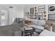 Comfortable living room with stylish decor, gray sectional sofa, and a view of the staircase at 13326 Blue Amber Ct, Parker, CO 80134