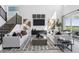 Spacious living room featuring modern decor, comfortable seating, and natural light at 13326 Blue Amber Ct, Parker, CO 80134