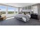 Bright main bedroom with scenic views from large windows at 13326 Blue Amber Ct, Parker, CO 80134