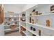 Spacious walk-in pantry featuring ample white shelving for organized storage of food and kitchen essentials at 13326 Blue Amber Ct, Parker, CO 80134