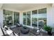 Relaxing covered patio area with comfortable seating and sliding glass doors to the home's interior at 13326 Blue Amber Ct, Parker, CO 80134