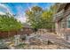 Backyard of home with deck and stone patio at 2203 Bellaire St, Denver, CO 80207