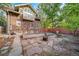 Brick home with deck and raised garden beds at 2203 Bellaire St, Denver, CO 80207