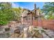 Home's backyard with patio and raised planters at 2203 Bellaire St, Denver, CO 80207