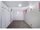 Spacious finished basement bedroom with carpeting and built-in storage at 2203 Bellaire St, Denver, CO 80207