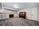 Finished basement recreation room with fireplace and antique piano at 2203 Bellaire St, Denver, CO 80207