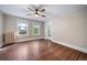 Charming bedroom with hardwood floors, ceiling fan and radiator at 2203 Bellaire St, Denver, CO 80207