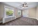 Bright bedroom with ceiling fan and neutral carpeting at 2203 Bellaire St, Denver, CO 80207