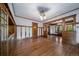 Bright dining room boasts hardwood floors and built-in storage at 2203 Bellaire St, Denver, CO 80207