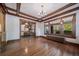 Formal dining room features hardwood floors, wood beams, and built-in cabinetry at 2203 Bellaire St, Denver, CO 80207