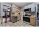 Kitchen offers stainless steel appliances and ample cabinetry at 2203 Bellaire St, Denver, CO 80207