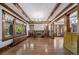 Spacious living room with hardwood floors, built-ins and fireplace at 2203 Bellaire St, Denver, CO 80207