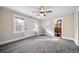 Spacious living room with ceiling fan and large windows at 2203 Bellaire St, Denver, CO 80207