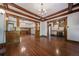 Open living room with hardwood floors, high ceilings and wood details at 2203 Bellaire St, Denver, CO 80207