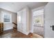 Upper hallway with built-in storage and hardwood floors at 2203 Bellaire St, Denver, CO 80207