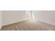 Cozy bedroom with neutral carpet, base molding, and a large window allowing for natural light at 718 N Clubview St, Watkins, CO 80137