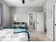 Secondary bedroom, carpeted with ensuite access, including a desk and closet space at 9406 Bross St, Arvada, CO 80007