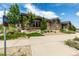 Exterior view of community center with walking trail access and professional landscaping at 9406 Bross St, Arvada, CO 80007