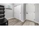 Clean entryway with storage and hooks, providing organized space for coats and bags at 9406 Bross St, Arvada, CO 80007