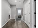 Upstairs hallway with natural light and hardwood floors, providing access to rooms at 9406 Bross St, Arvada, CO 80007
