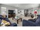 Bright, open floor plan showcases a living room and dining area, perfect for modern living at 9406 Bross St, Arvada, CO 80007
