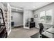 Spacious office featuring a sleek desk and ample natural light from the window at 9406 Bross St, Arvada, CO 80007