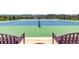 Well-maintained community tennis courts surrounded by trees and neighboring homes at 9406 Bross St, Arvada, CO 80007