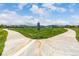 Community walking trail surrounded by green space and scenic mountain views at 9406 Bross St, Arvada, CO 80007